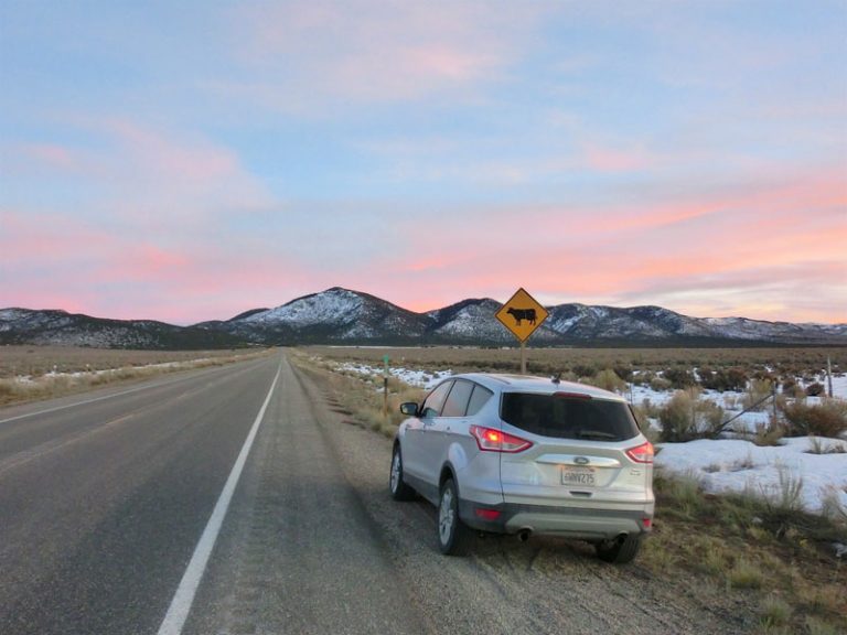 jackson to bryce roadtrip Ford Escape in sunset in Utah